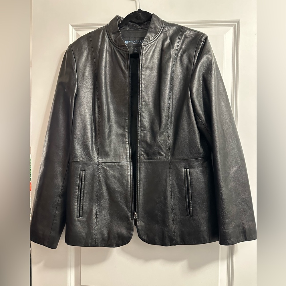 Women's Reaction by Kenneth Cole Size L. Two zipper pockets and zipper front.